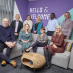 Some of the Community Ventures team sit in their newly refurbished office