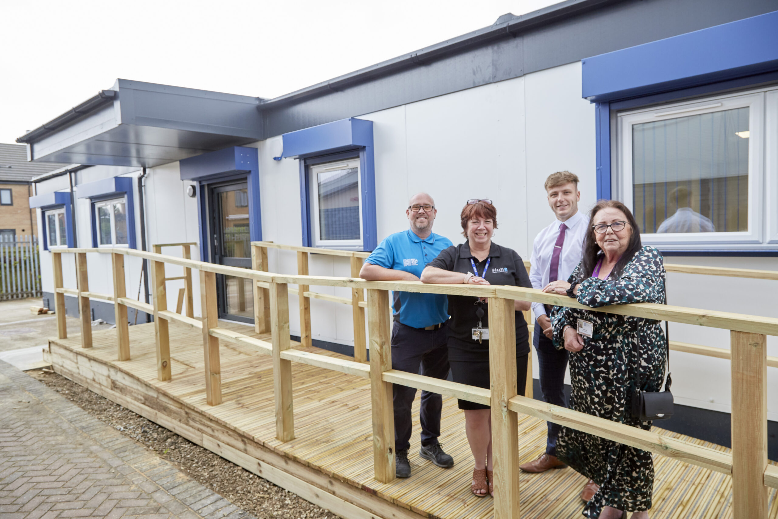 Graham Lawson of Sewell Construction, Amanda Skinner of HTAE, Harry Hopkin of Esteem and Councillor Linda Tock of Hull City Council stand outside the new classrooms